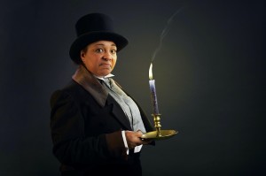A Christmas Carol Scrooge with candle press shot copy